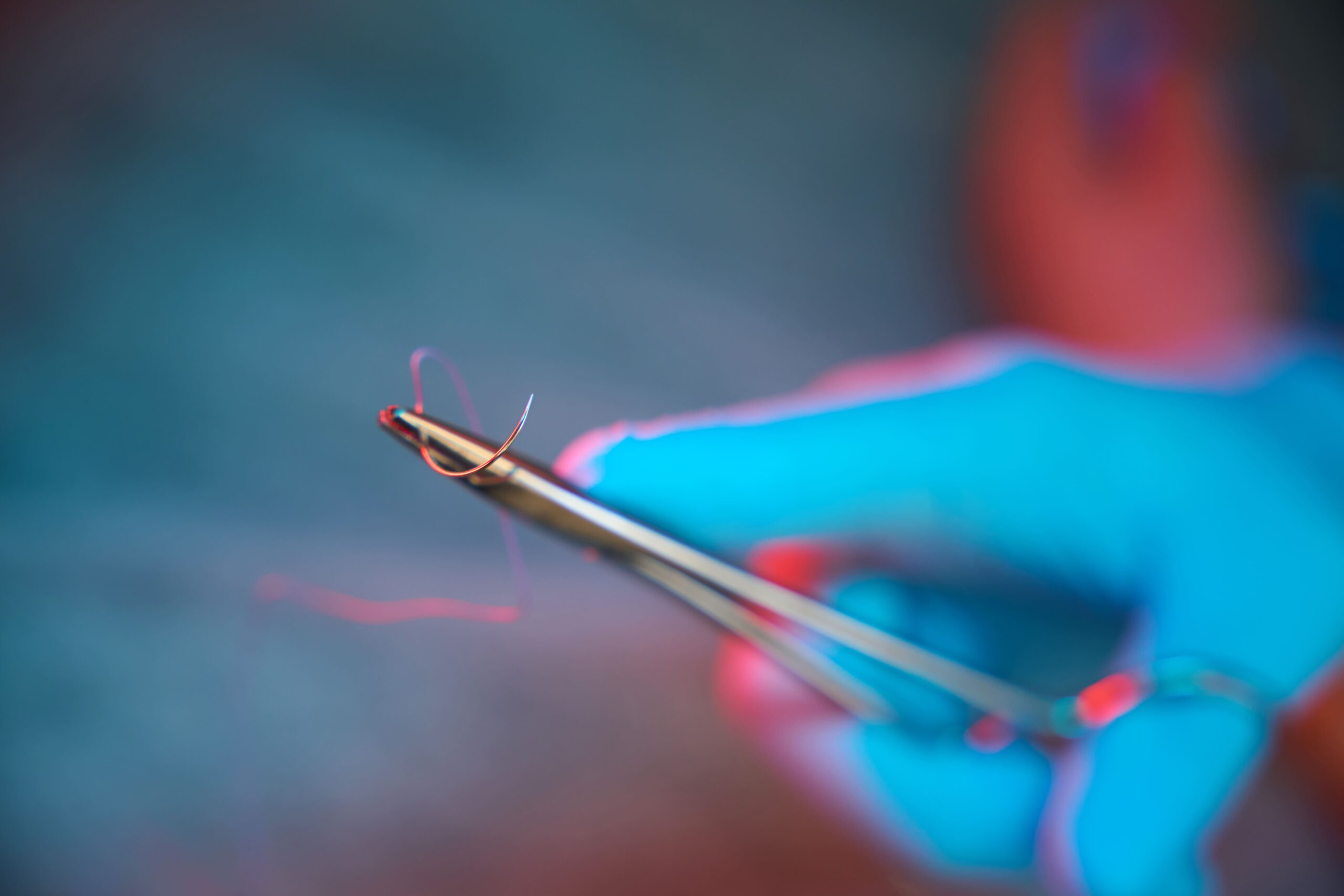 Holding surgical needle with suture thread